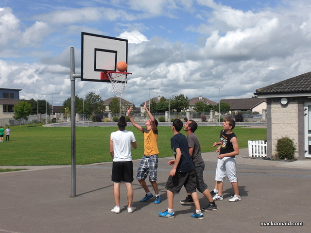 Boys playing basketball